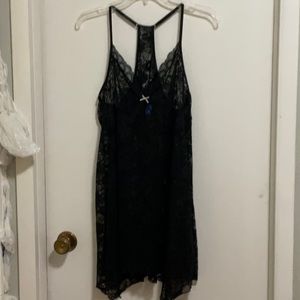 black babydoll top with shark bite hem and racer back with adjustable straps